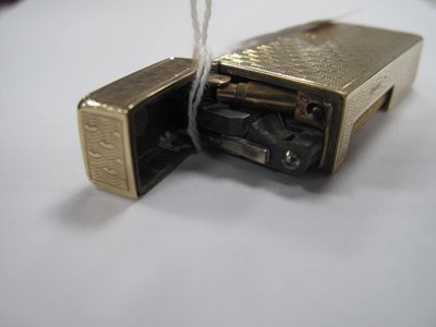 Lot 142 - Dunhill; A 9ct Gold Cigarette Lighter, allover...
