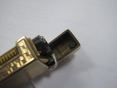 Lot 142 - Dunhill; A 9ct Gold Cigarette Lighter, allover...