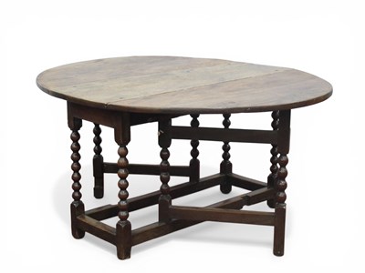 Lot 1587 - A XVII Century Oak Gateleg Table, with drop...