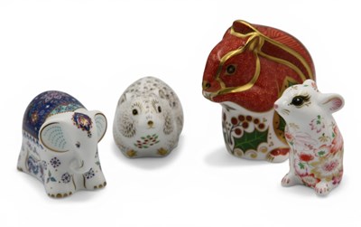 Lot 1105 - Four Royal Crown Derby Porcelain Paperweights,...