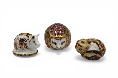 Lot 1102 - Three Royal Crown Derby Porcelain Paperweights,...