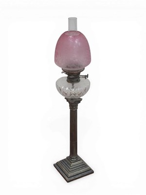 Lot 1242 - An Oil Lamp, the silver plated corinthian...