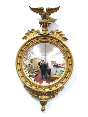 Lot 1518 - A Regency Style Gilt Convex Wall Mirror,...