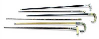 Lot 1268 - A XX Century Walking Stick, the white metal...