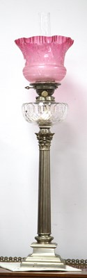 Lot 1241 - An Early XX Century Oil Lamp, the white metal...