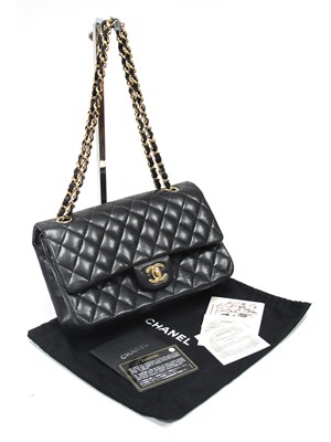 Lot 1431 - CHANEL; A Medium Classic Double Flap Handbag,...
