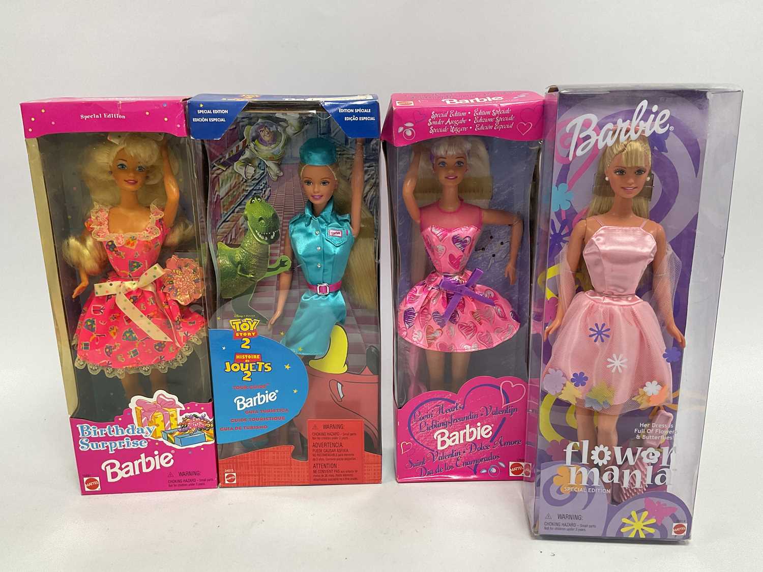 Lot 306 - Four Modern Mattel Special Edition Barbie...