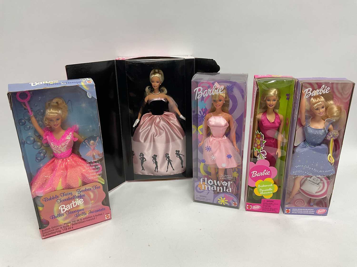 Lot 311 - Five Modern Mattel Barbie Dolls, comprising of...