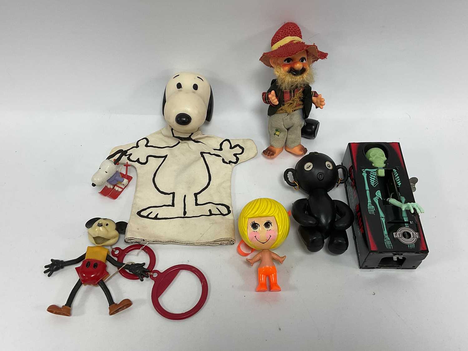 Lot 303 - Six Plastic and Tinplate toys made in Hong...