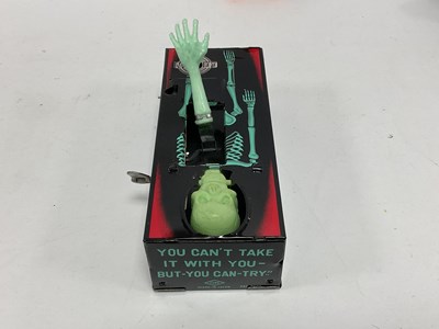 Lot 303 - Six Plastic and Tinplate toys made in Hong...