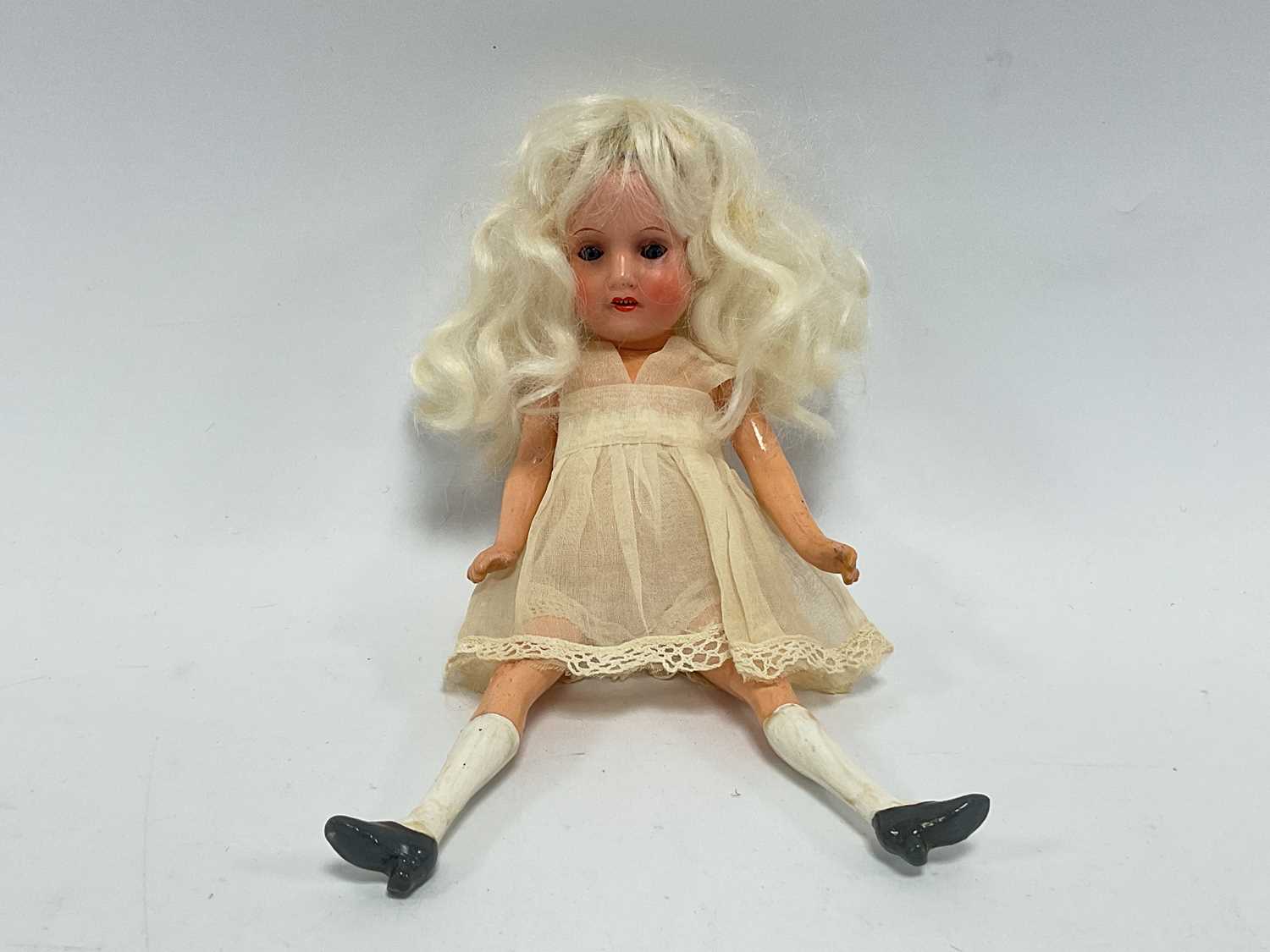 Lot 312 - A Small Bisque Headed German doll, with blue...
