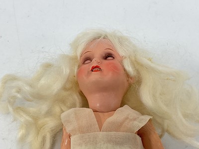 Lot 312 - A Small Bisque Headed German doll, with blue...
