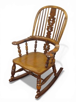 Lot 1606 - A XIX Century Yew-Elm Pad Arm Rocking Chair,...