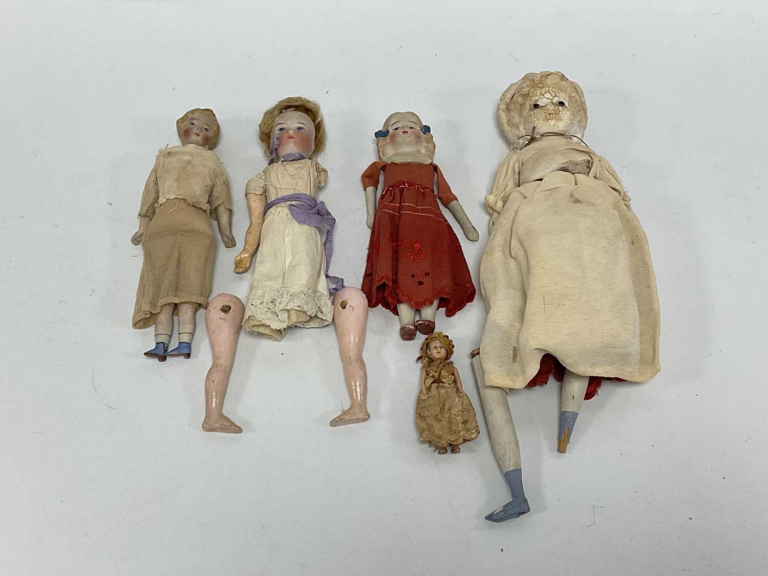 Lot 319 - A collection of six Bisque / Paper Mache...