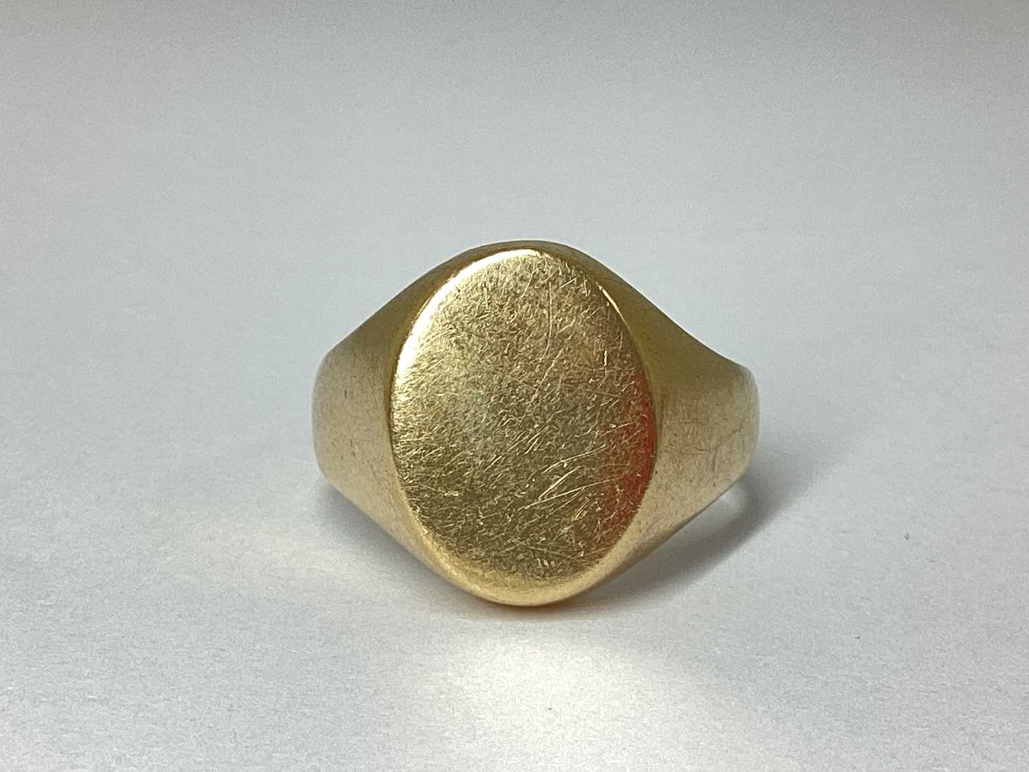 Lot 80 - A Chunky Oval Panel Signet Ring, of plain...