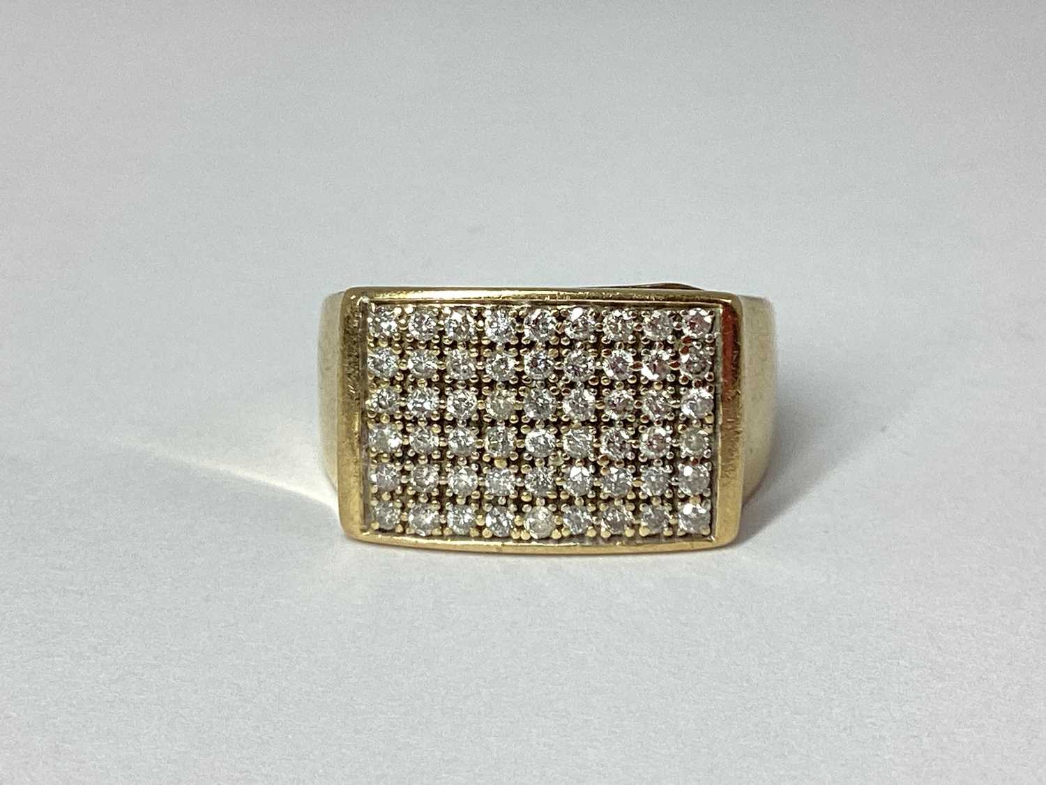 Lot 90 - A Gent's 9ct Gold Diamond Set Ring, the...