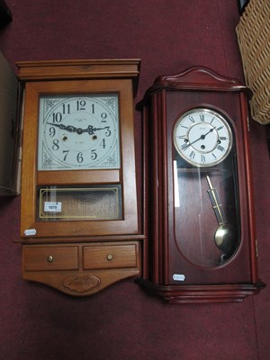 Lot 1079 - Two wooden cased wall clocks: German Hermle...