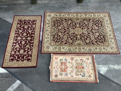 Lot 1484 - Kamira Belgian Rug, foral on central burgundy...