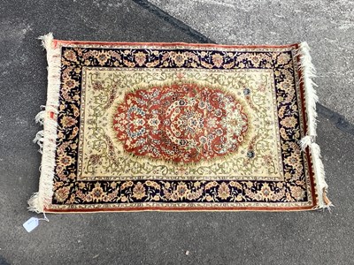 Lot 1478 - A Silk Hereke Rug Highly decorated on cream...