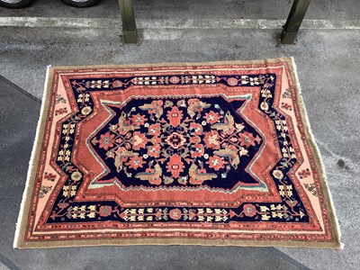 Lot 1483 - A Handmade Persian Rug decorated with a large...