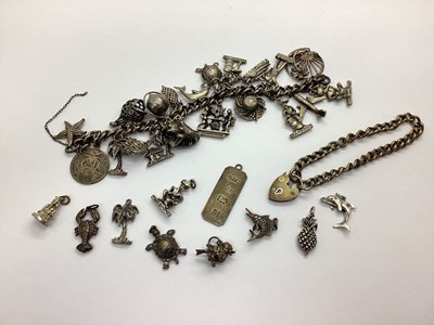 Lot 135 - A Curb Link Charm Bracelet, (lacking clasp)...