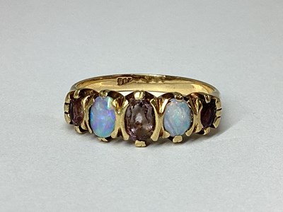 Lot 80 - An Opal Set Five Stone Dress Ring, alternately...