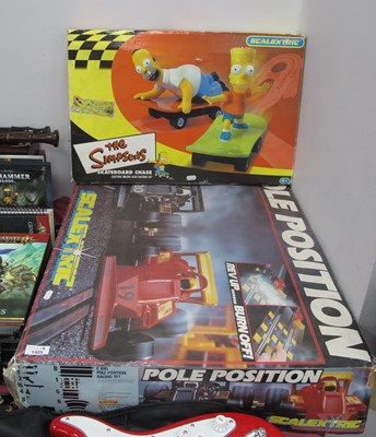 Lot 1325 - Two boxed Scalextric games: The Simpson...