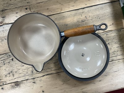 Lot 1026 - Cast iron enamelled kitchenware, including...