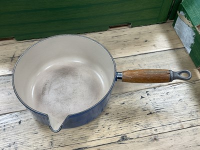 Lot 1026 - Cast iron enamelled kitchenware, including...