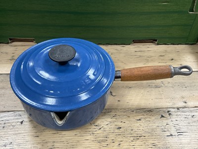 Lot 1026 - Cast iron enamelled kitchenware, including...
