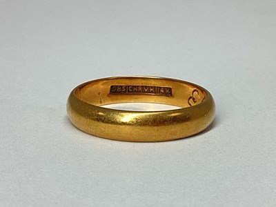 Lot 67 - A Plain Wedding Band, stamped "585 CHR.V.H.14K"...