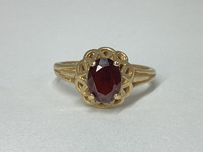 Lot 73 - A 9ct Gold Dress Ring, oval claw set, within...