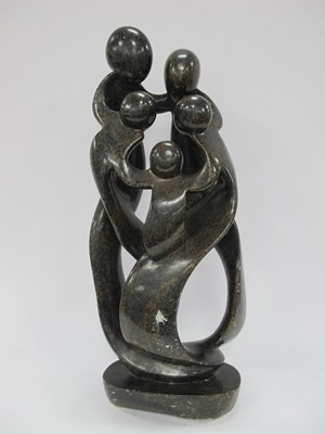 Lot 1406 - A large dark stone sculpture depicting...