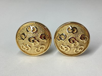 Lot 125 - Christian Dior; A Pair of Gilt Metal Circular...