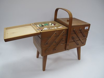 Lot 1399 - A vintage wooden accordion-style sewing box...