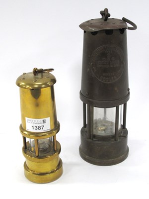 Lot 1387 - Two vintage brass miners lamps: Eccles example...