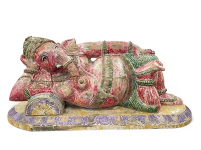 Lot 1529 - Painted Hardwood Carving of a Reclining Ganesh,...